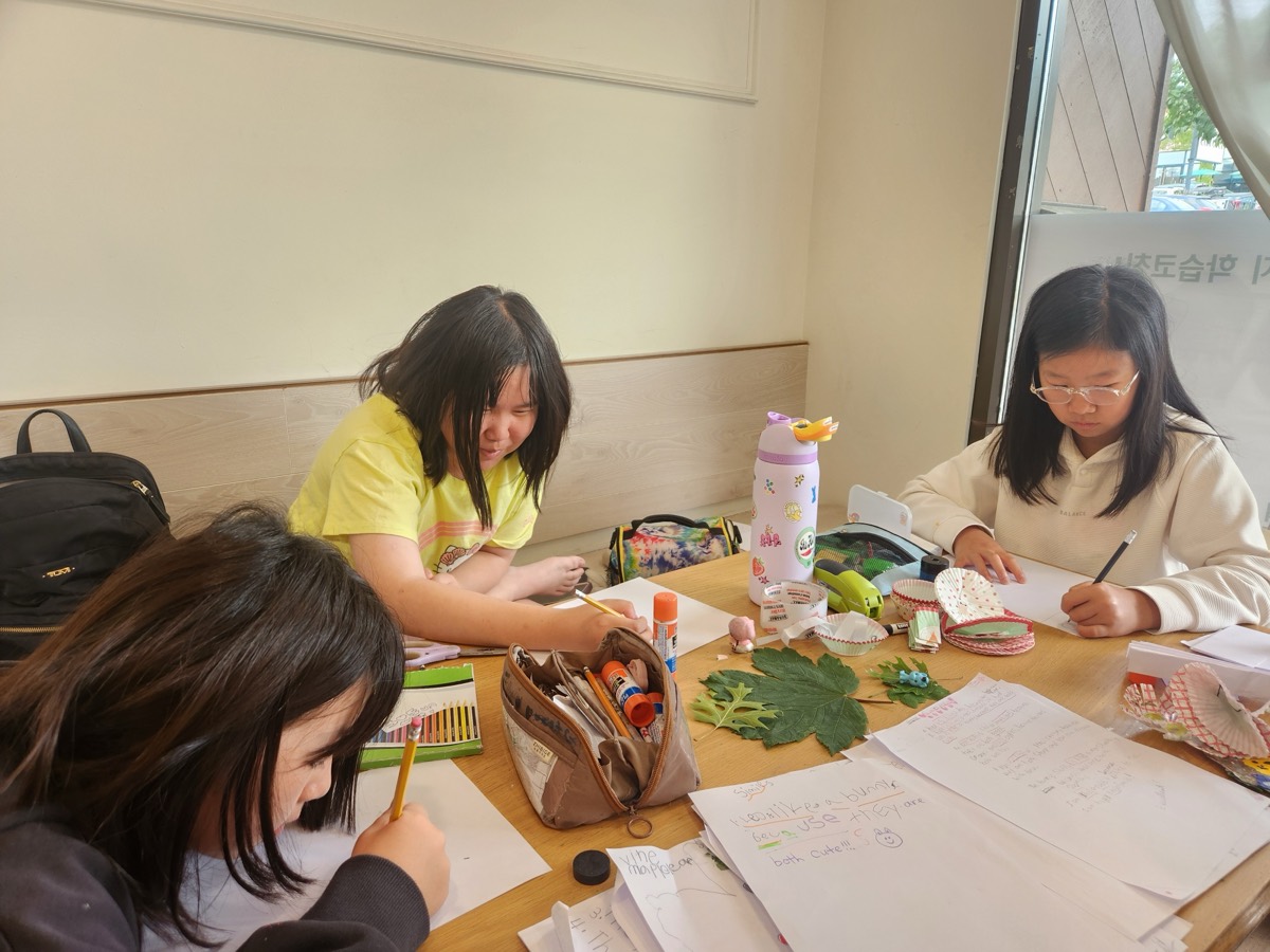 Children doing crafts using leaves
