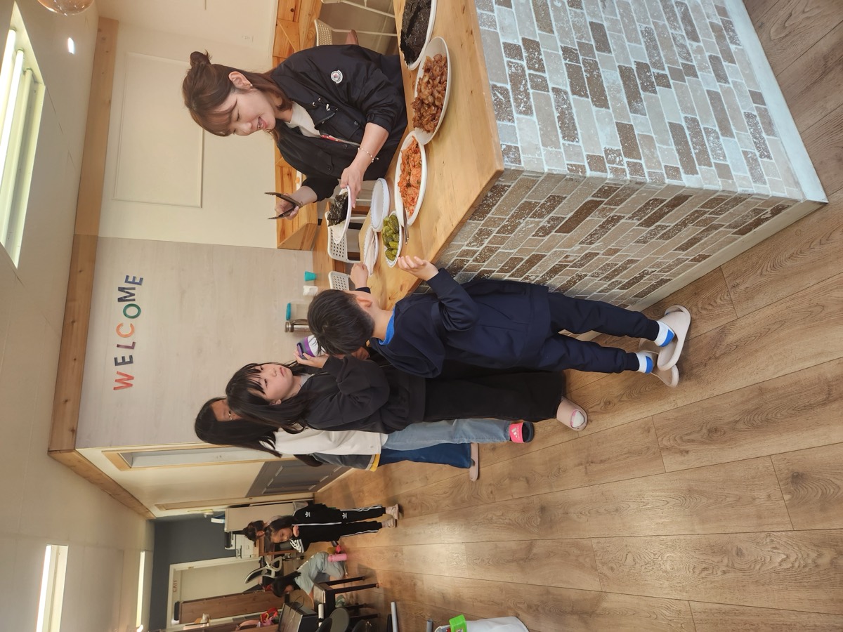 Children lining up at the counter waiting to be served
