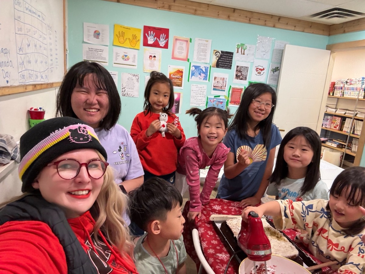 A group photo of the children and teachers together