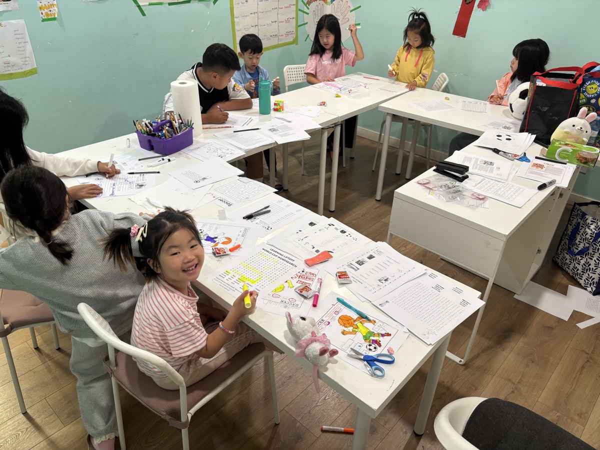 Children working at desks in the classroom
