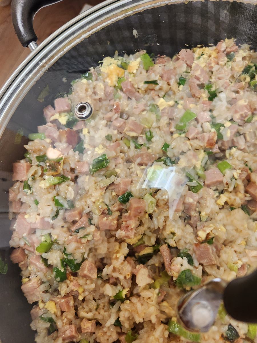 A large pan of vegetable fried rice