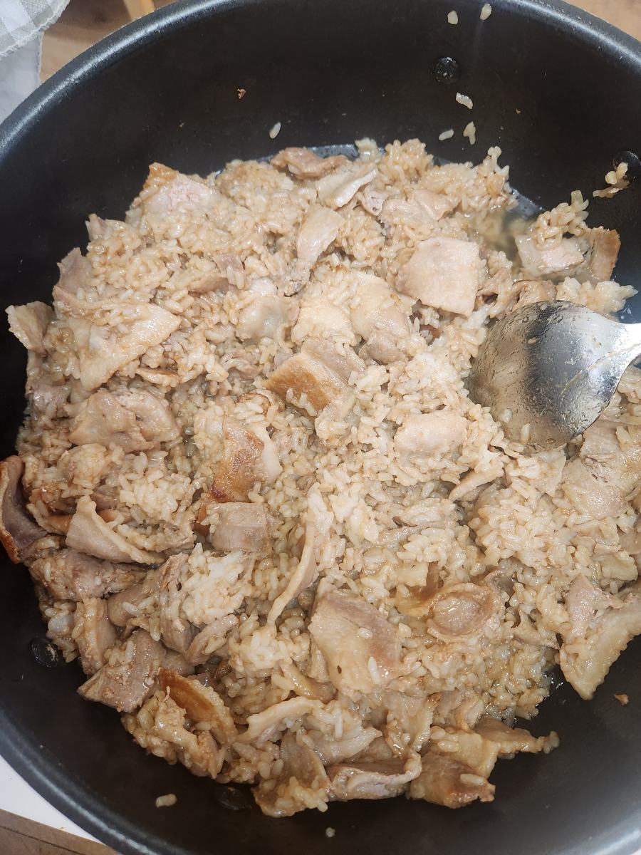 A large pot of shredded seasoned chicken