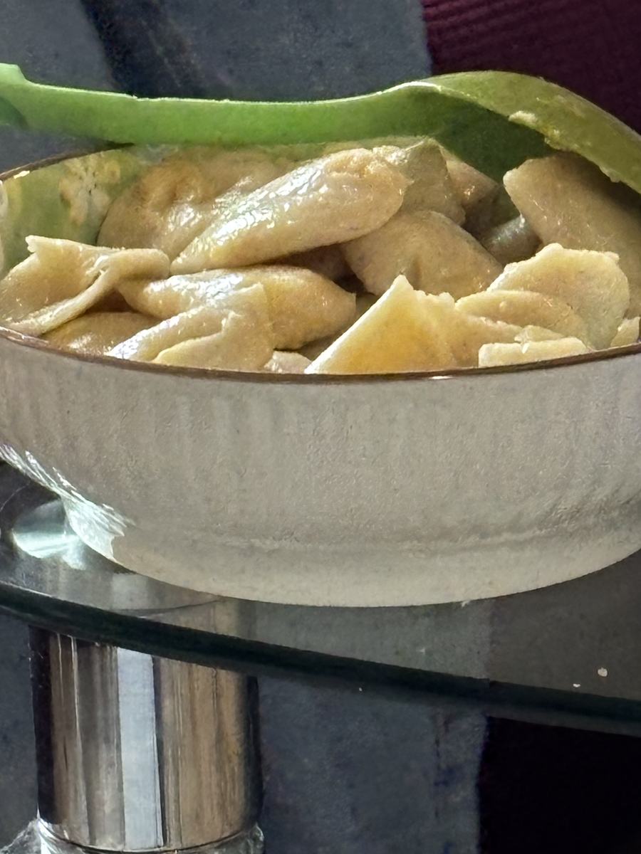 A bowl of steamed dumplings on the table