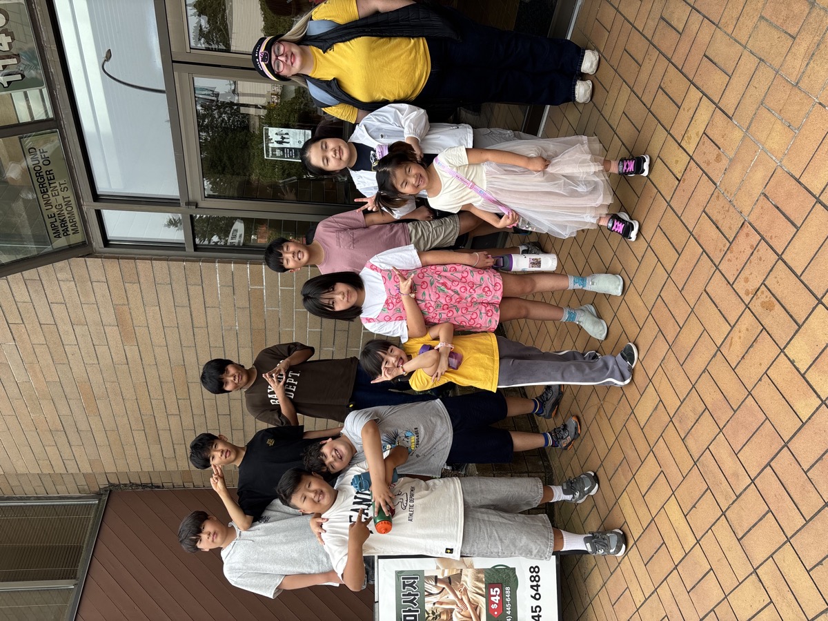 The whole summer camp group and their teachers gathered outside the centre