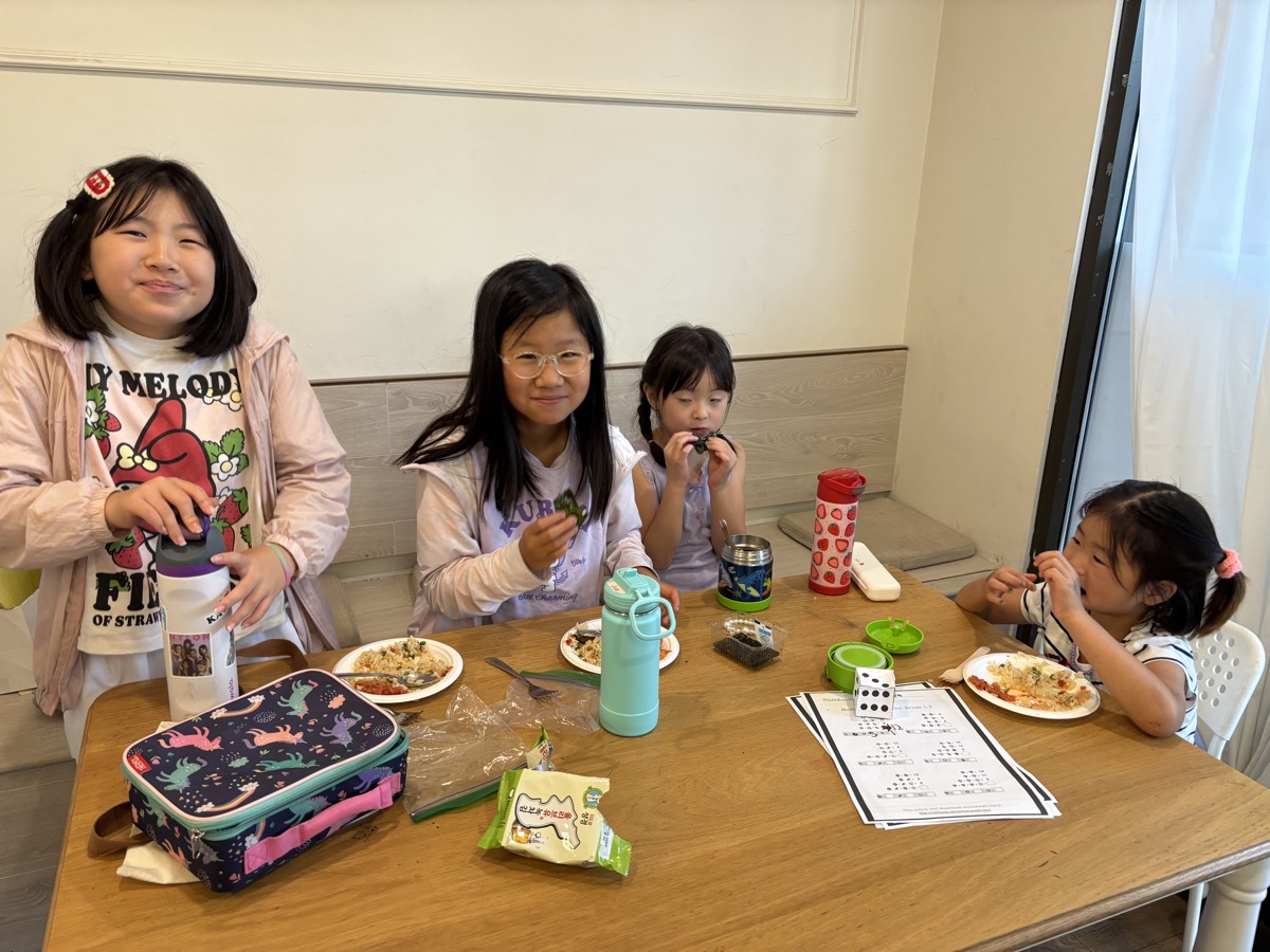 Students sitting together around the table during lunch