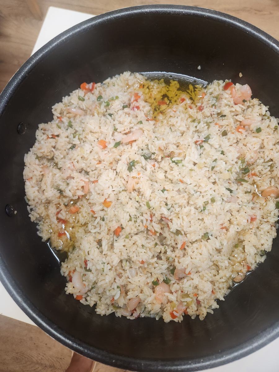 A large pan of vegetable fried rice