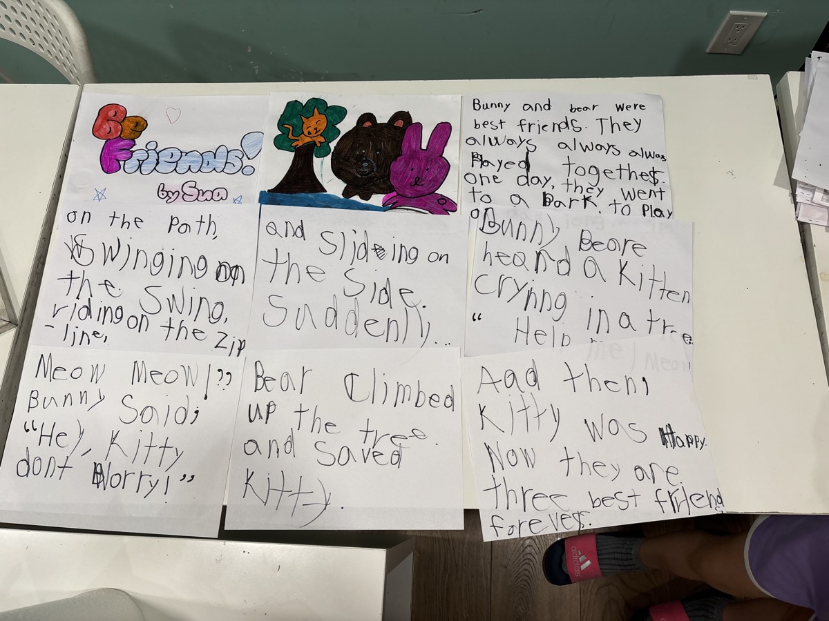 A story spread with illustrations of a bunny and bear saving a kitten
