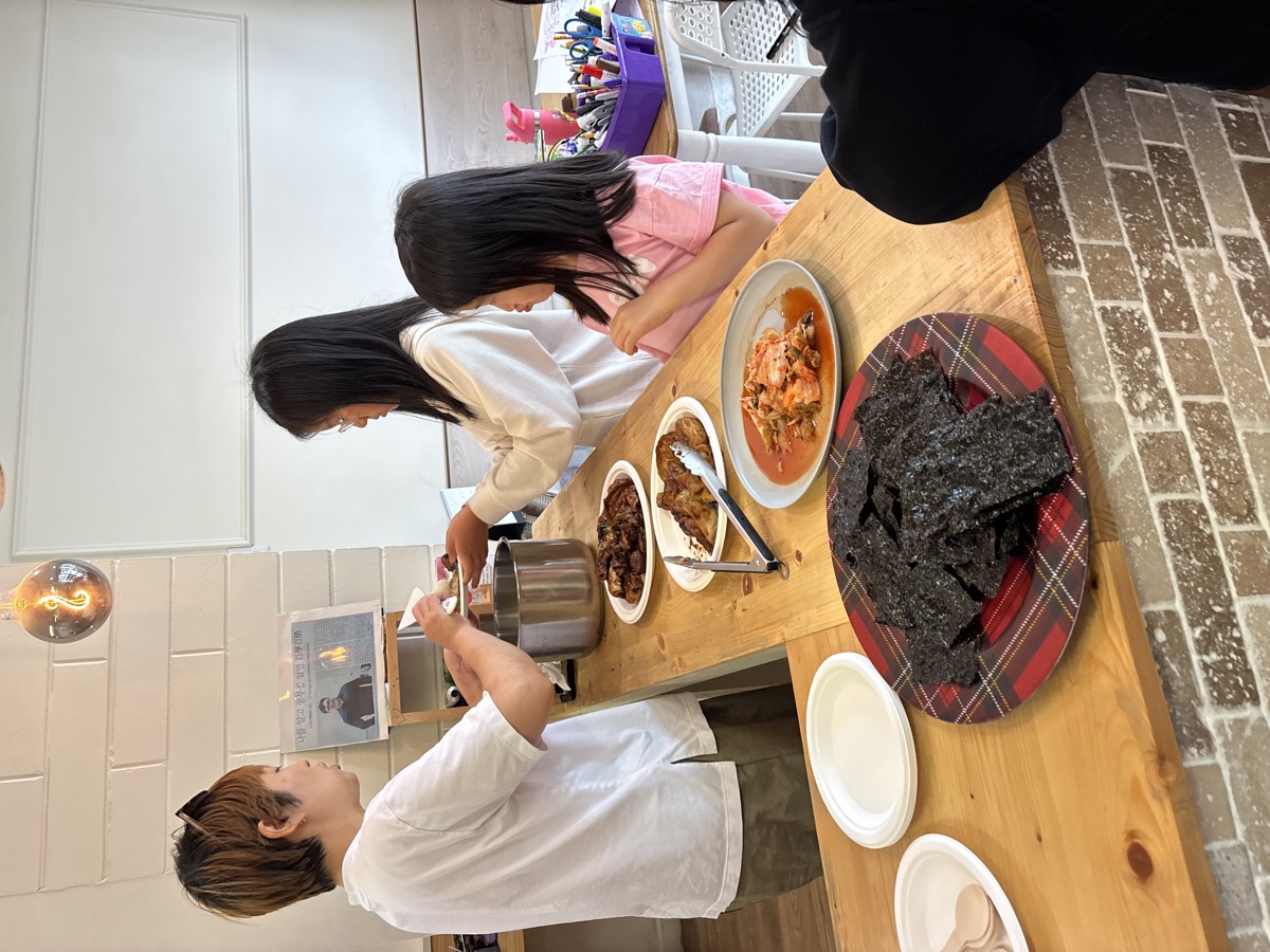 Lunch being served at the counter — bulgogi, kimchi, and roasted seaweed