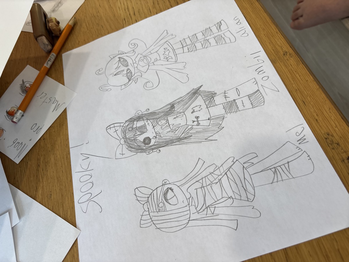 Pencil drawings of three spooky characters