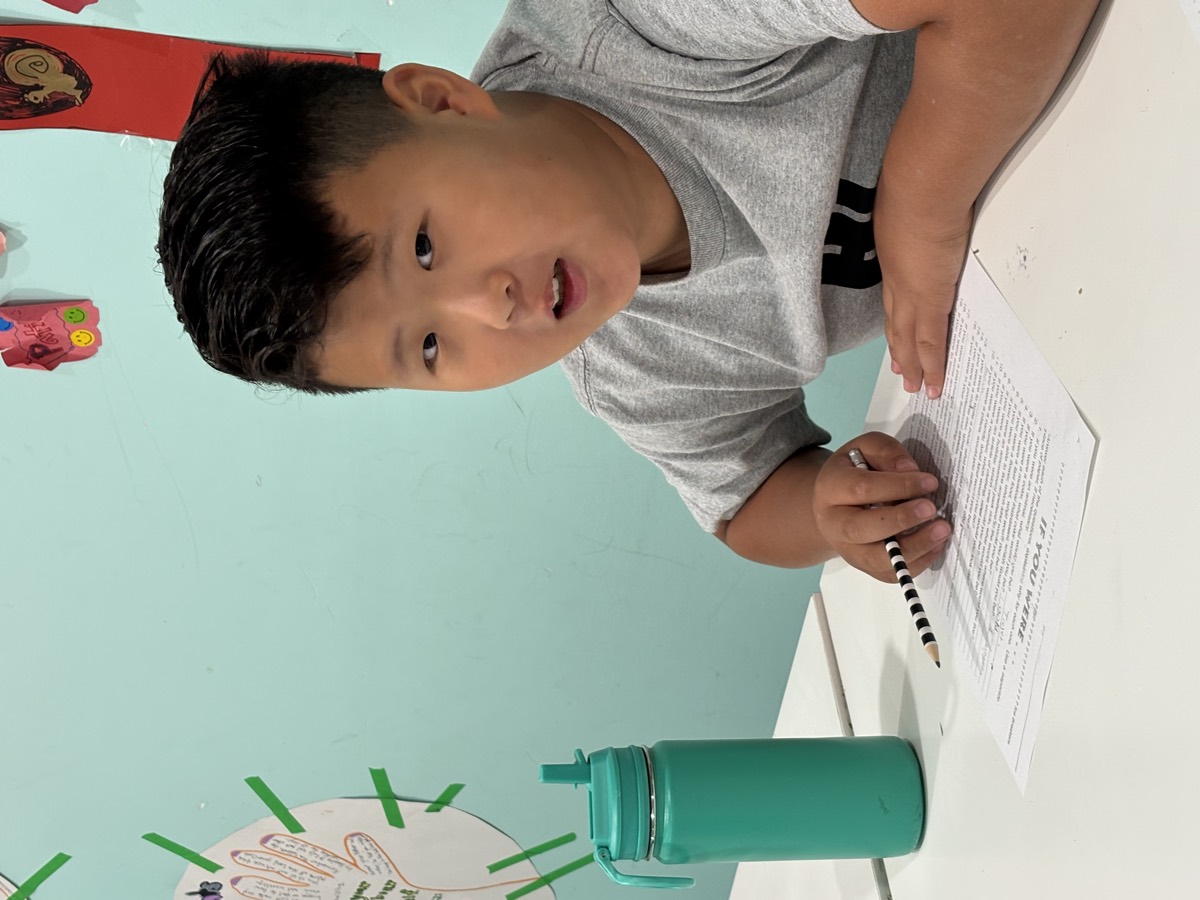 A boy working on his word-search worksheet