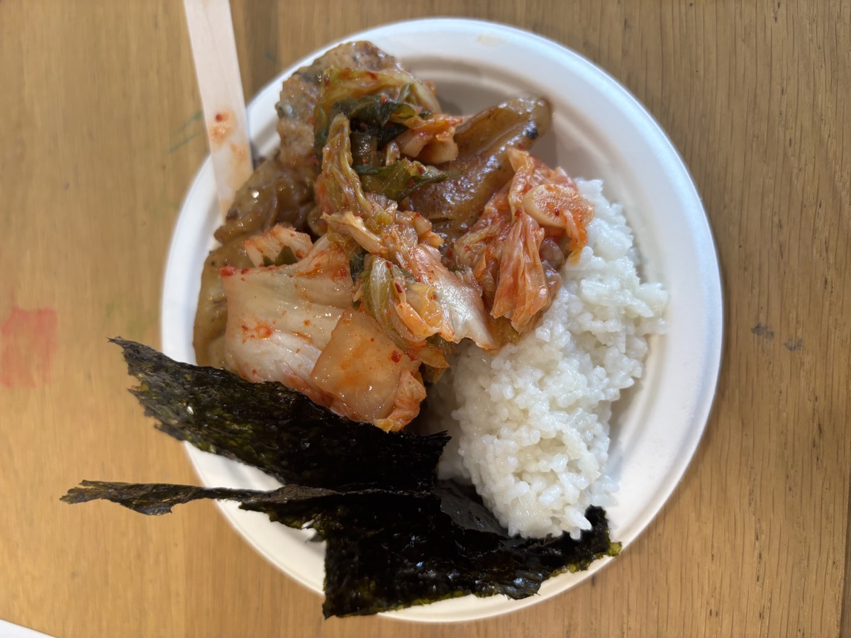 A plate with rice, kimchi, bulgogi and roasted seaweed