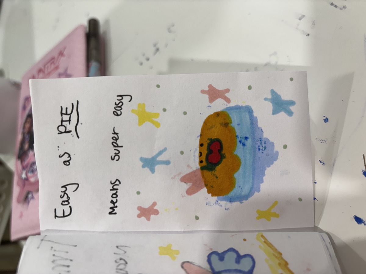 A booklet page reading Easy as PIE means super easy, with a drawing of a pie