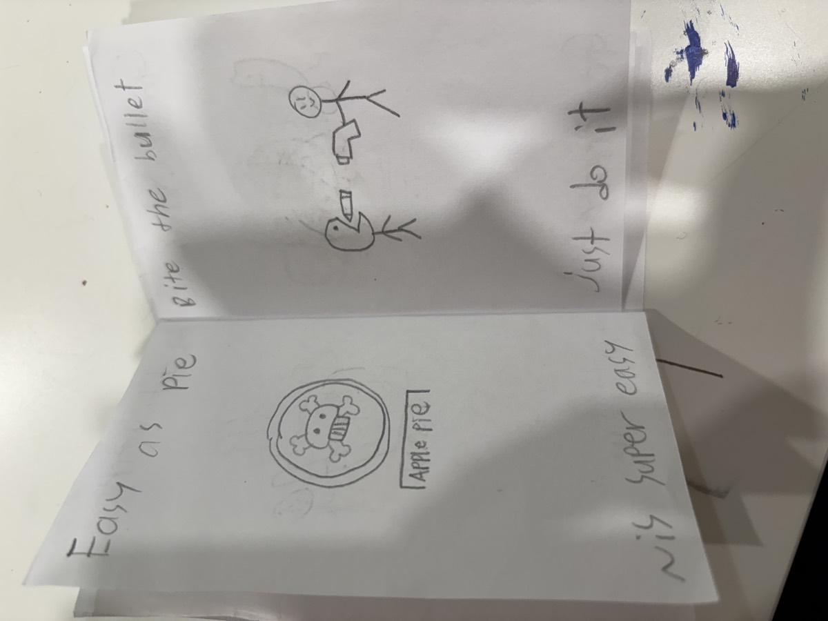 A pencil booklet spread reading Easy as pie, it's super easy, and Bite the bullet, just do it, with drawings of an apple pie and two stick figures